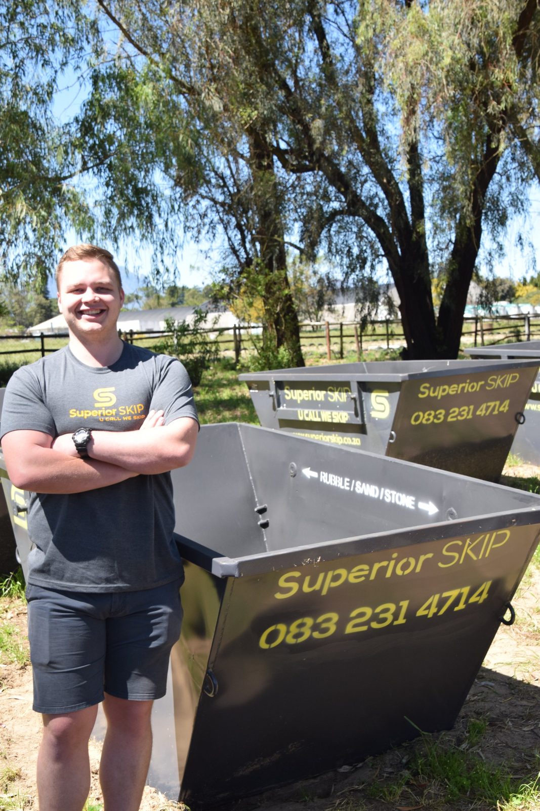 Superior Skip team member with the skip bin range